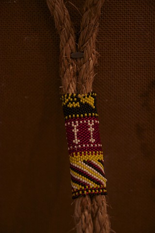 Peyote stitch with cut beads on twine rope