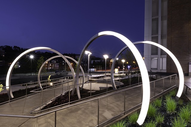 The Lunar Portal is a 10-foot-tall acrylic and stainless steel permanent public art installation created by interdisciplinary artist Shervone Neckles. This multi-part installation features a custom-built LED lighting system programmed to follow our 29 1/2