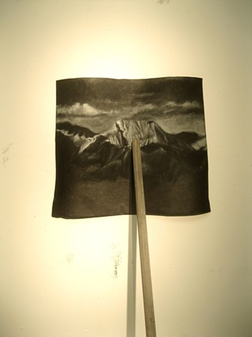broom on a pallet that holds up a drawing of a generic mountain landscape, romanticism, individualism