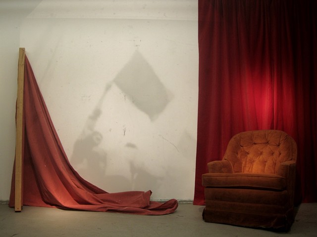installation about nostalgia, red symbolizing communism but also referencing David Lynch with the red drapes, a domestic space occupied by a objects of a failed revolution