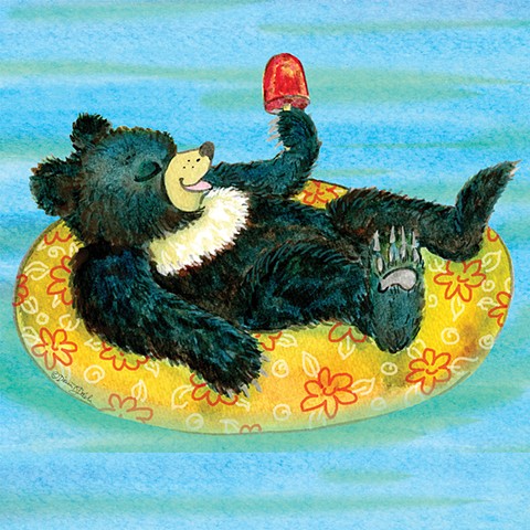 bear cub in a float enjoying a popsicle