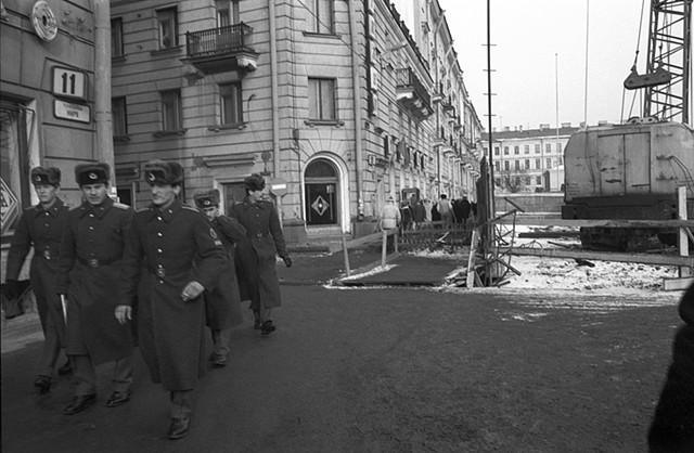 Soldiers walking along the street