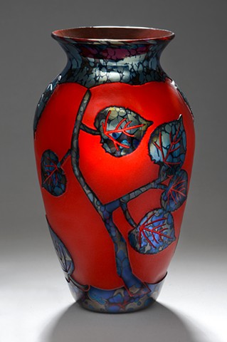 Brilliant red etched reduction black blown glass.