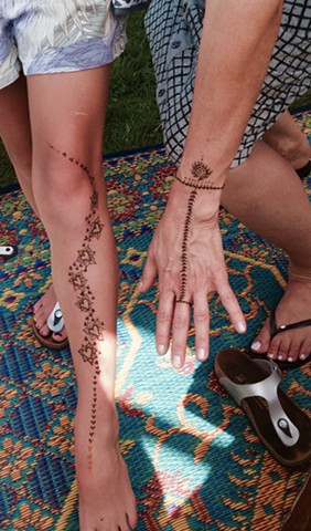 Henna leg and hand tattoo
