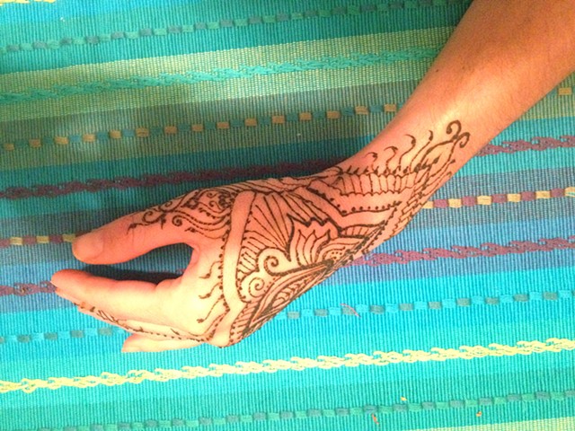 Side view of henna hand design