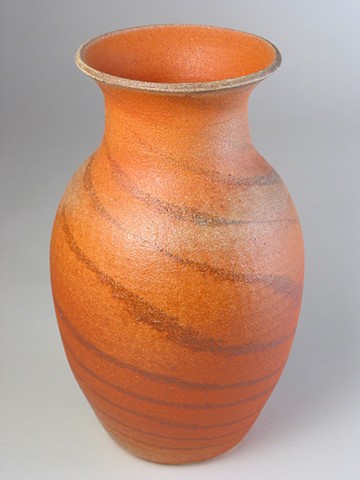 red and white clay with orange slip soda fired