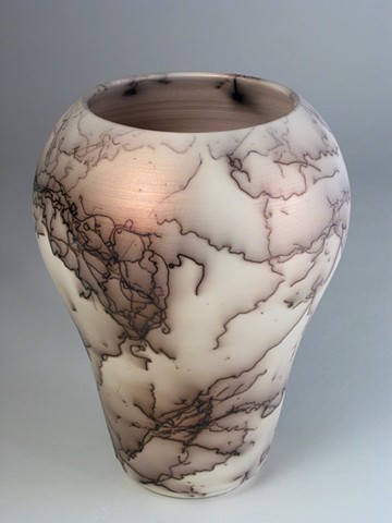 horsehair raku fired vase with red mica infused terra sigillata