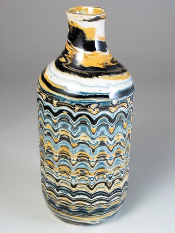 bottle made from colored clays covered in a clear glass glaze