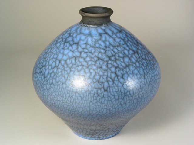 naked raku fired pot with blue terra sigillata