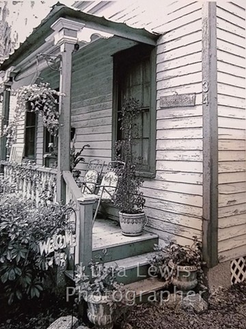 Photograph in Black and White of front porch on old wood house in St Augustine by Luna Lewis