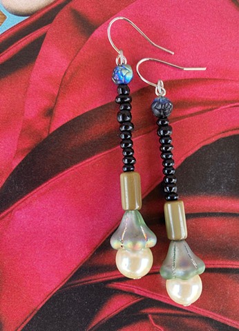 long dangle earrings with glass bead shaped like a lamp shade, and pearl bead