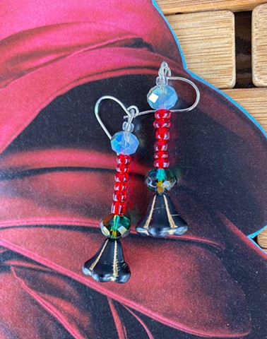 dangle earrings with magenta beads and glass bead shaped like a lamp shade