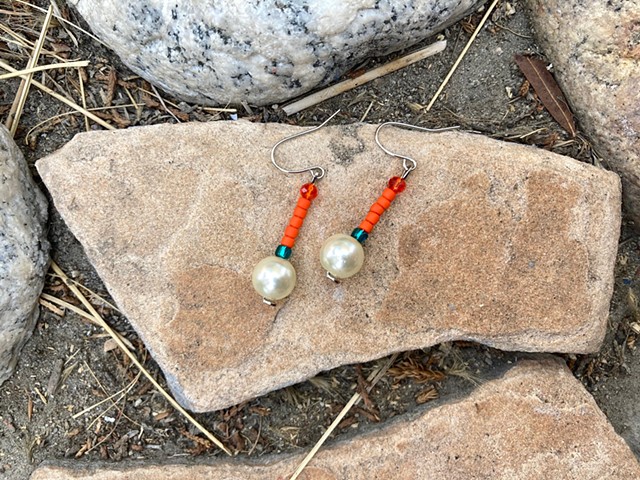 dangle earrings with bright orange beads and pearl