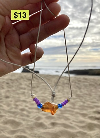 cord necklace with orange vintage bead