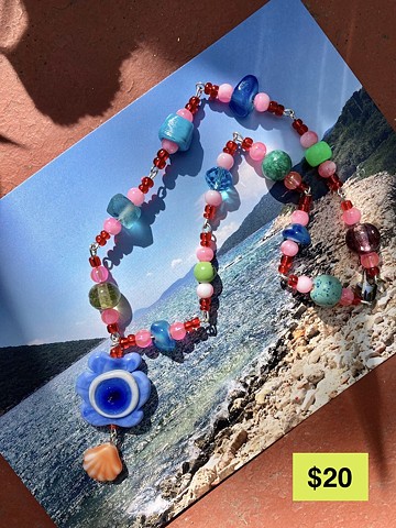colorful beaded necklace with evil eye glass pendant