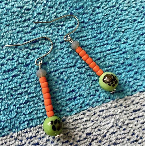 dangle earring with neon orange beads and green ball accent bead