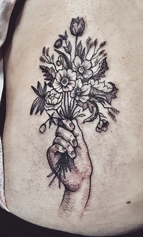 Hand holding flowers tattoo New Haven ct