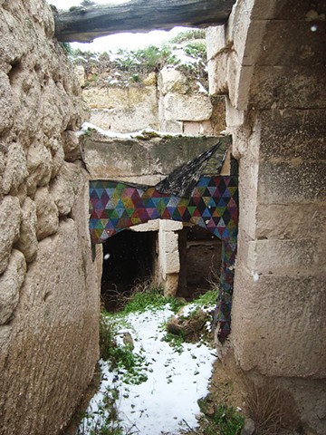 Temporary installation, paper on stone, Cappadocia, Turkey by Carmi Weingrod