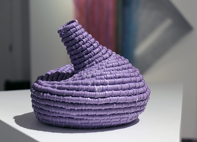 contemporary coiled basket sculpture made of lavender plastic lacing by Jose Santiago Perez
