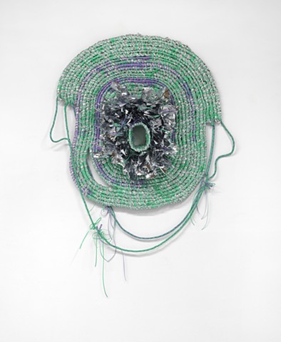 wall based abstract coiled basket made with emergency blankets and mint and lavender plastic lacing by José Santiago Pérez