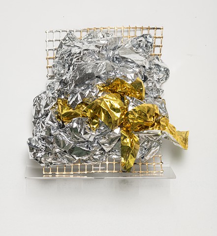 sculpture made with woven silver and gold emergency blankets, plastic mesh, and silver and gold leaf by José Santiago Pérez