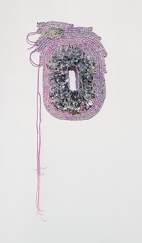 wall based abstract coiled basket made with emergency blankets and lavender and pink plastic lacing by José Santiago Pérez