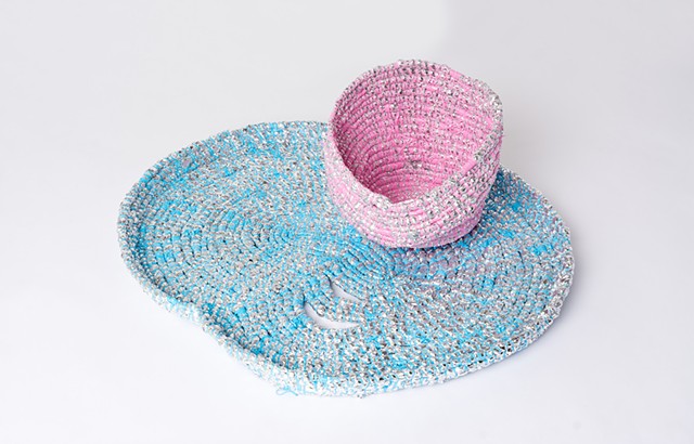 abstract coiled basket made with emergency blankets and blue and pink plastic lacing by José Santiago Pérez