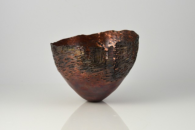 Raised and etched copper vessel with patina