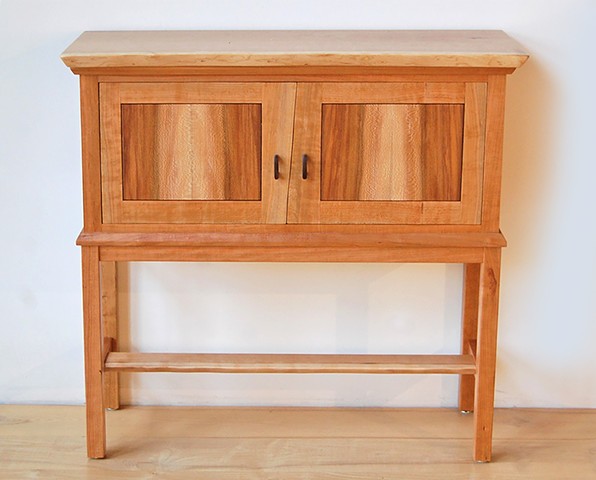Petit Sideboard -  cherry with live edge door stiles, and book-matched sycamore panels, live edge top with a blonde sapwood stripe.  
36 high x 37 wide x 14 deep
