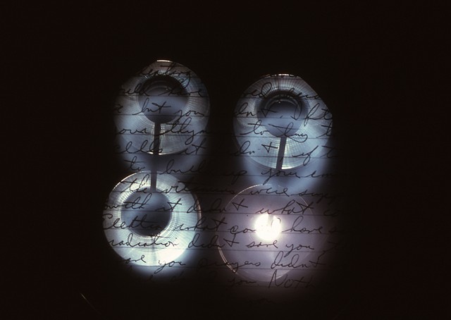 Elektra Mou, My Elektra. 1994. Ortho and Duraclear transparencies. Candles, audio, emergency room light. 20ft x 9ft.