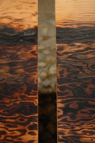 Closer (Detail) Stones seen through wood panels
