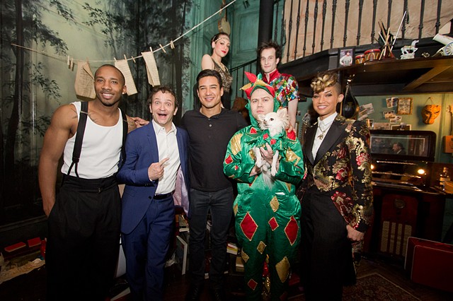 Some of the cast of "Vegas Nocturne" posing with Mario Lopez in front of the Forest Mural for the Cloak Room.
