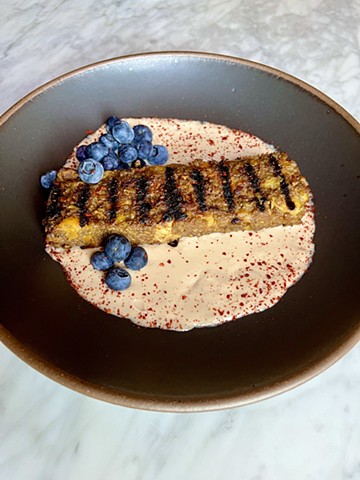 grilled oatmeal, almond cream, blueberries, chili salt