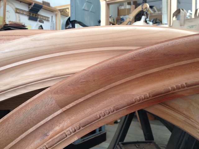 mahogany arches before carving and one in progress with the ball and baton.