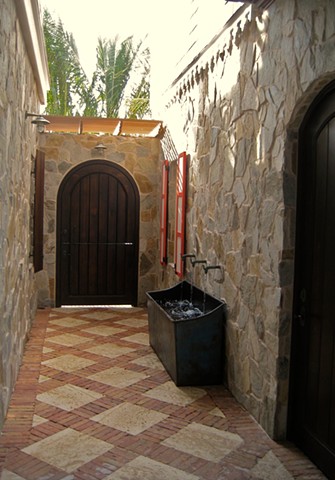 entrance before accessories.
antique horse trough as fountain