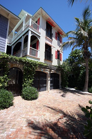 garage elevation with detail of brick driveway and entrance