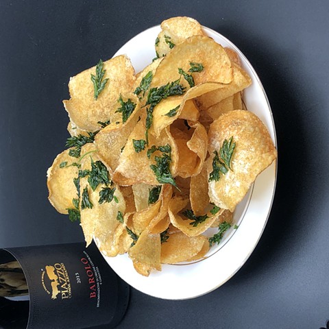 kennebec chips fried in ghee, fried parsley, xeres vinegar salt