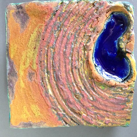 Handbuilt ceramic tiles for wall display. Aerial view.  Slice of land.