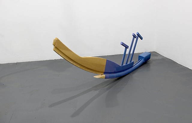 sculpture created with found furniture, paint, concrete; title is Parkland