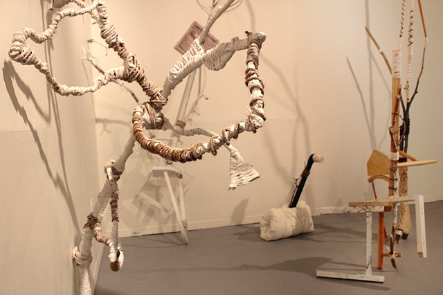 sculptural installation made from found furniture, tree limbs, jute, cotton yarn, gesso, paint, PVC