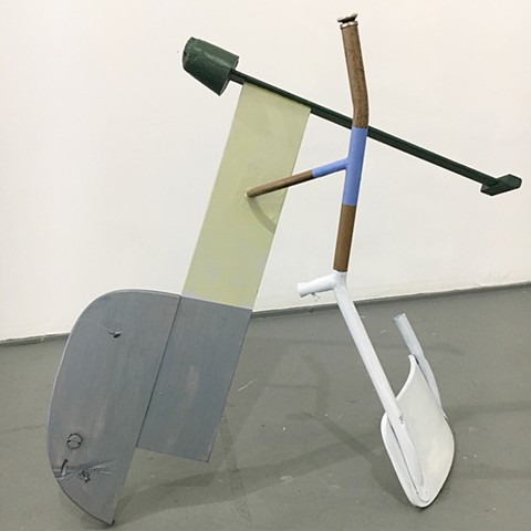 sculpture created with found furniture, paint, plaster; title is Commencement