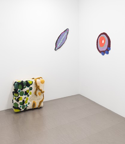 an install shot with 3 works