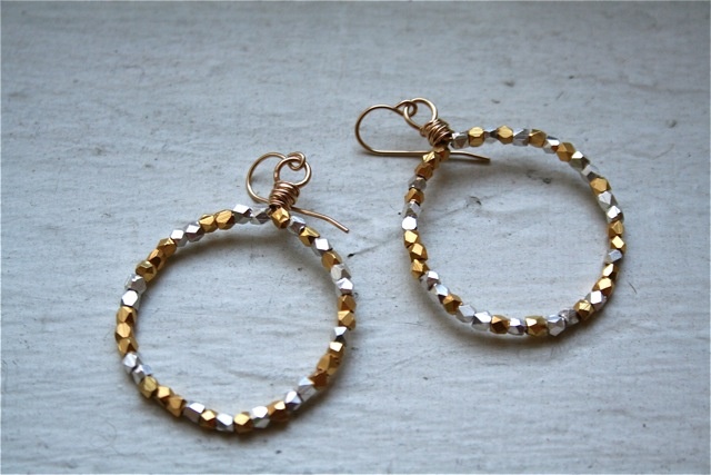 glam it up with these small gold hoops studded with sparkly silver and gold beads.  