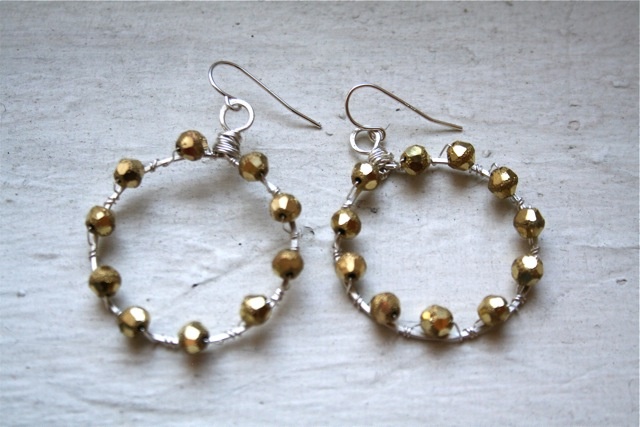 delicate silver hoops studded with sparkly, faceted beads.