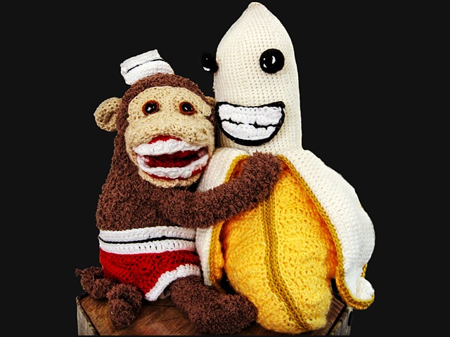 Crochet monkey and banana toy crochet yarn fiber art by Pat Ahern.
