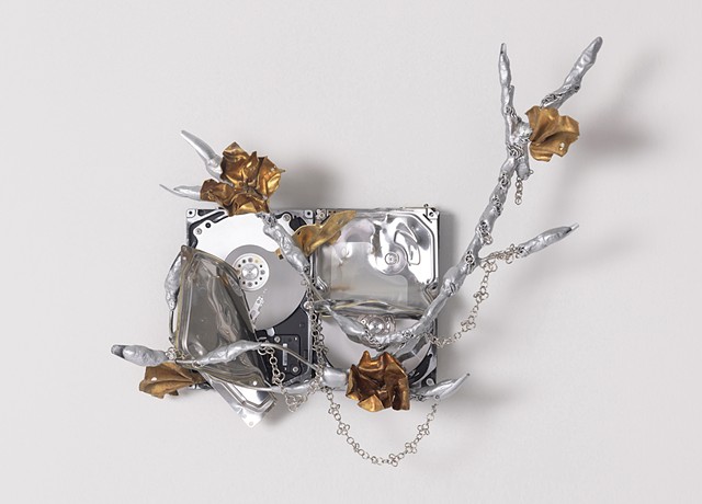 Parasitic Ghost 3, 2025  35x42x16cm, Discarded hard disk, wire, O-ring, artificial nails, brass, mixed media