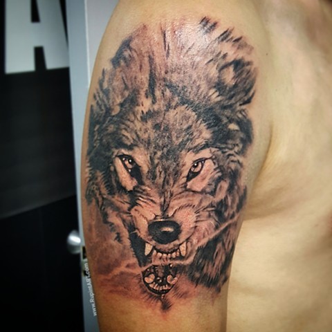 wolf tattoo. growling wolf. realistic tattoo