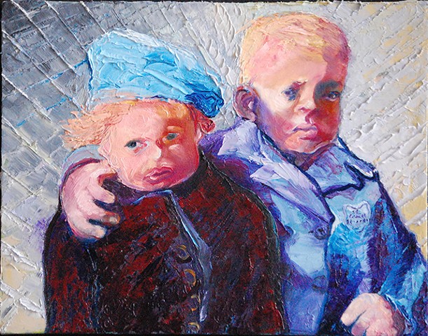 young boy and girl in a heavily painted painting field