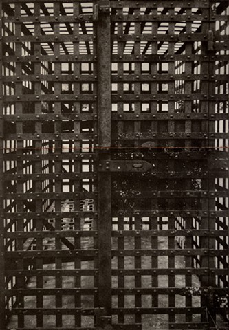 A 19th c. jail preserved in Niagara, North Dakota, is a lattice metal box. Two-plate polymer photogravure print on pescia paper by John Pearson.