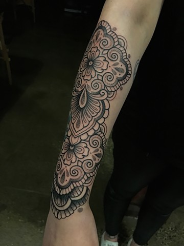 Ornamental forearm tattoo in black ink by Alvaro Flores Tattooer in Melbourne Australia at La Flor Sagrada Tattoo Studio in Coburg